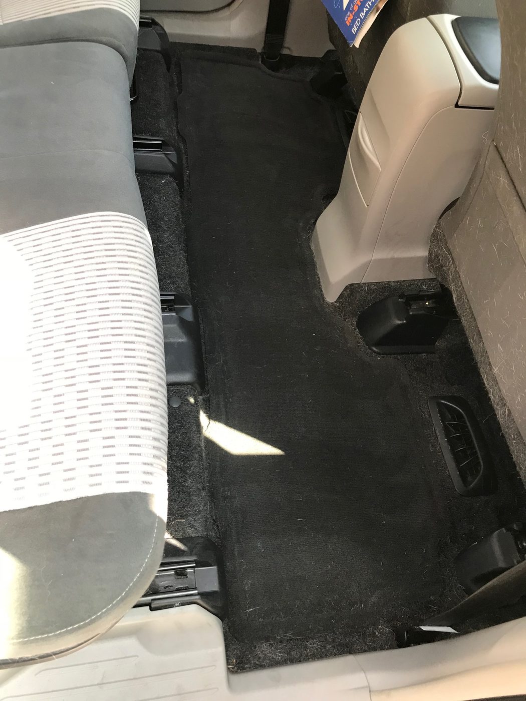 Same interior carpet completely cleaned and shampooed after detail at Fair Oaks Car Wash