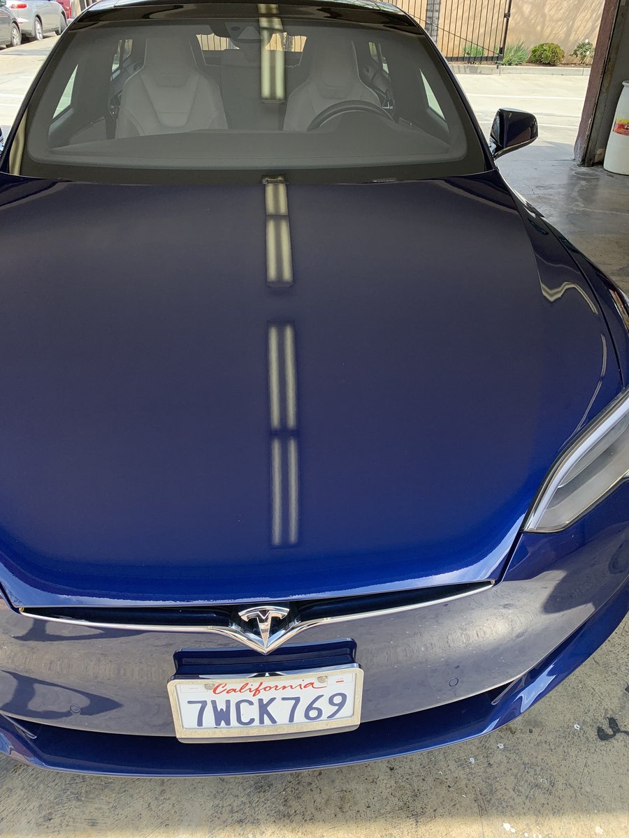 Same Tesla Model S after graffiti removal and paint restoration at Fair Oaks Car Wash