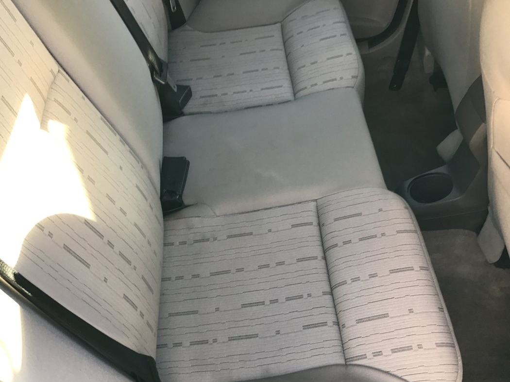 Freshly cleaned cloth interior seats after Interior Detail at Fair Oaks Car Wash