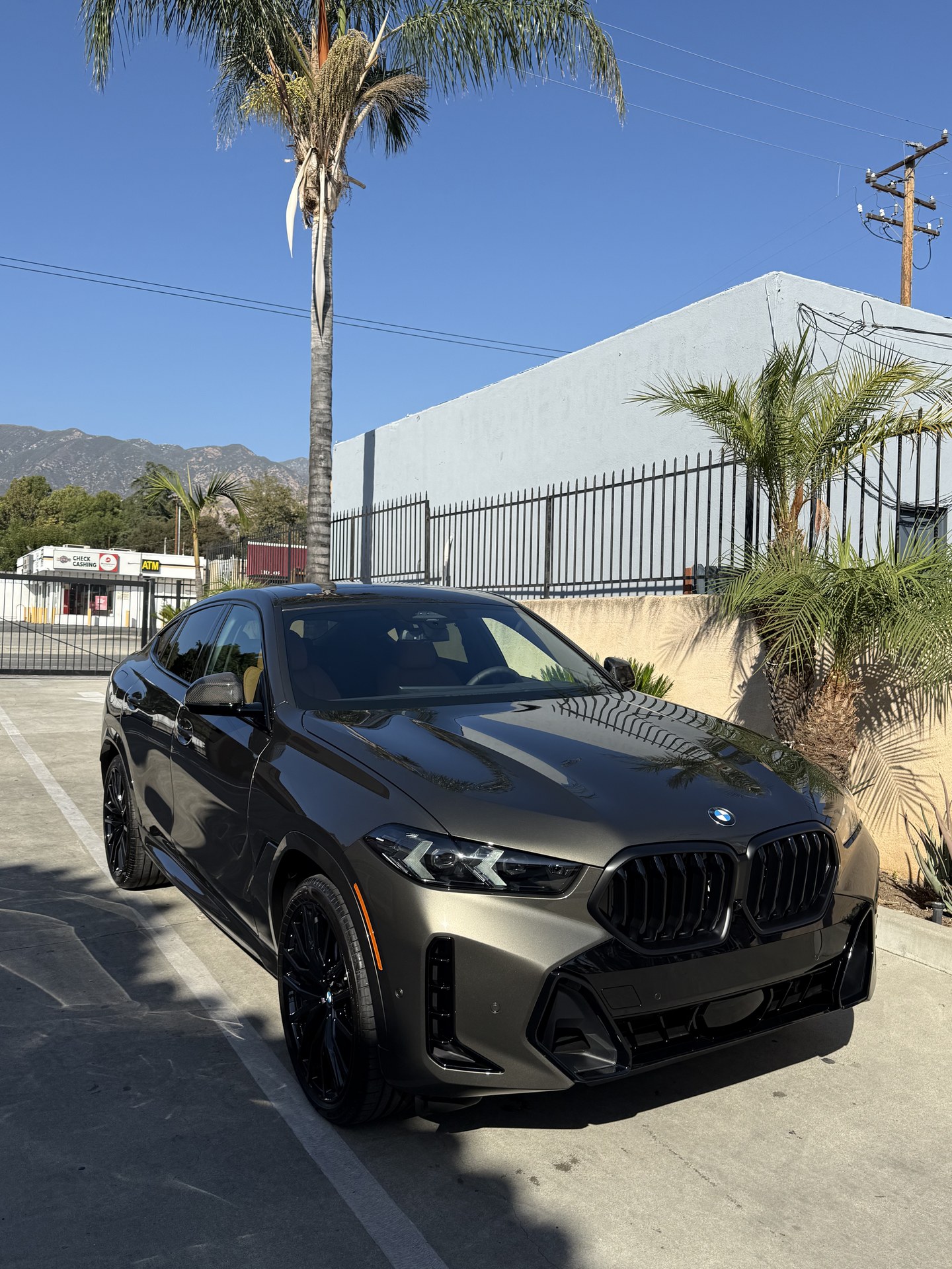 Bronze BMW X6 M60i finished at Fair Oaks Car Wash in Altadena
